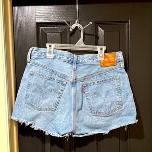 Levi's Light Blue Jean Shorts. Factory cutoff, 501 button fly.
